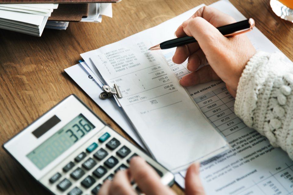 Bookkeeping workspace with calculator and paperwork